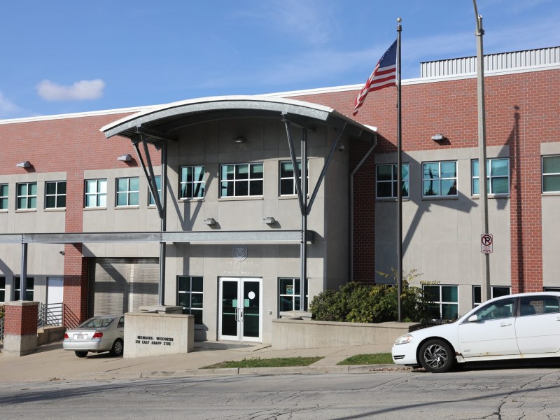 Building front with car parked out front