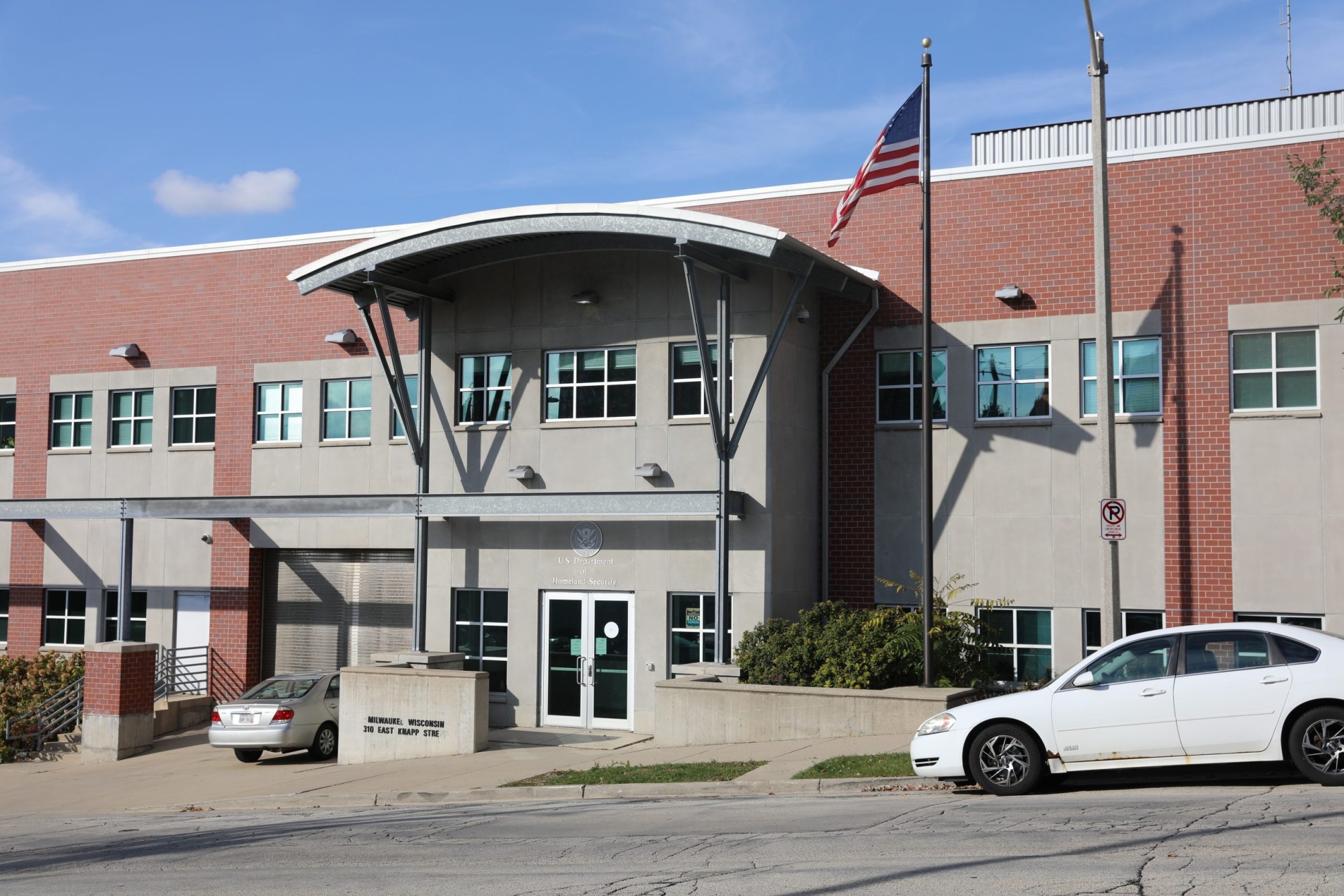 Building front with car parked out front