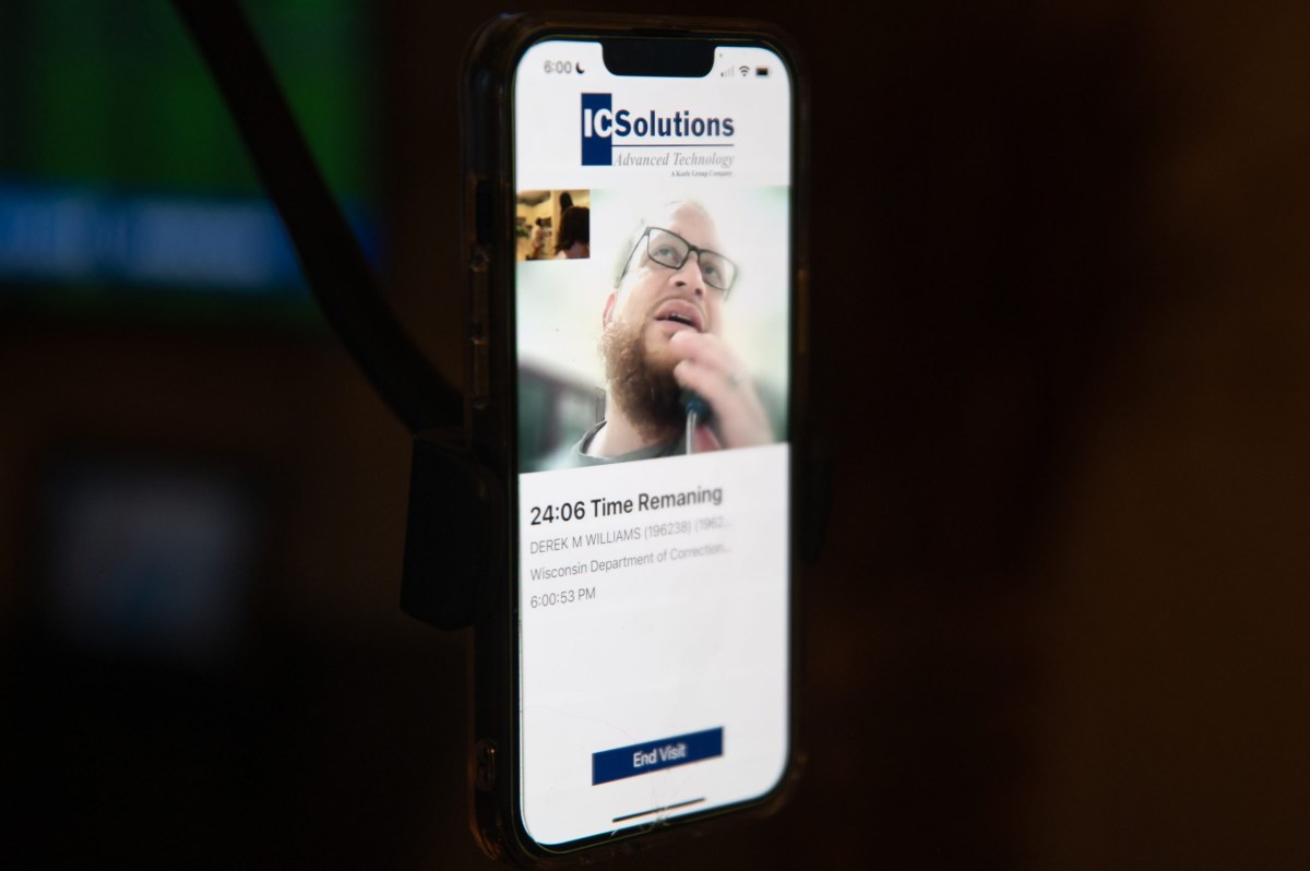 A smartphone screen displays a video call on the ICSolutions app showing a person with glasses and a beard, with text reading "24:06 Time Remaining" and an "End Visit" button at the bottom.