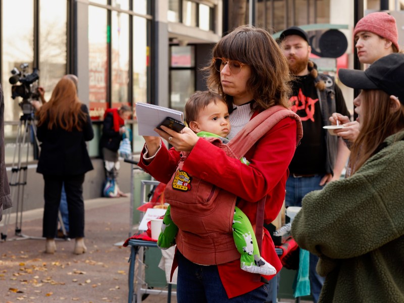 Natalie Yahr in red top with young child