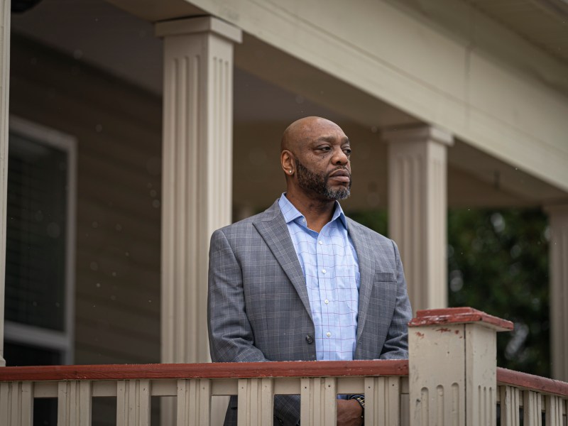 Man stands on porch